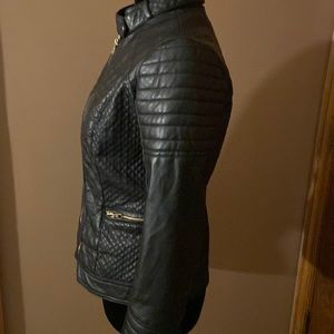 Women’s faux leather jacket with zippers